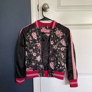 The zip up jacket from Urban Republic is an M(10/12) but on the smaller side.